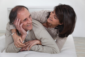 Older couple laying in bed