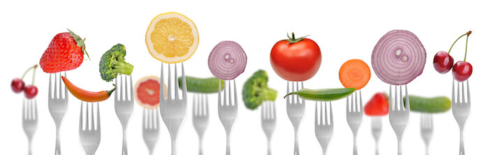 healthy fruits and veggies on a fork