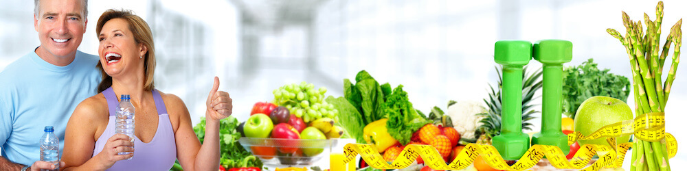 Healthy Older couple in front of fruits and vegetables